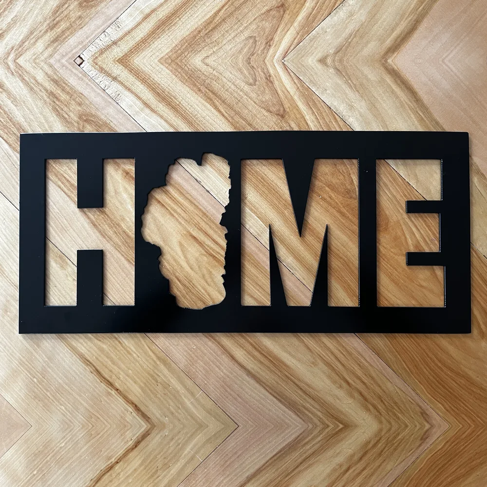 Black steel Tahome sign with Lake Tahoe as the O.