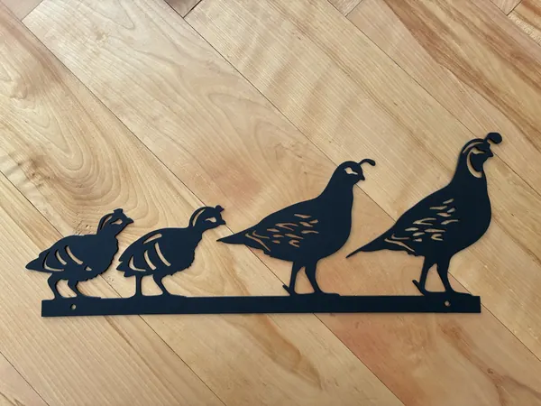 Black steel quail family silhouette with two adults and two chicks